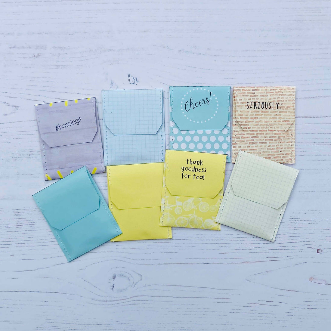 Colorful handcrafted envelopes for Boss Tea Giftset, featuring unique designs and cheerfully themed messages.