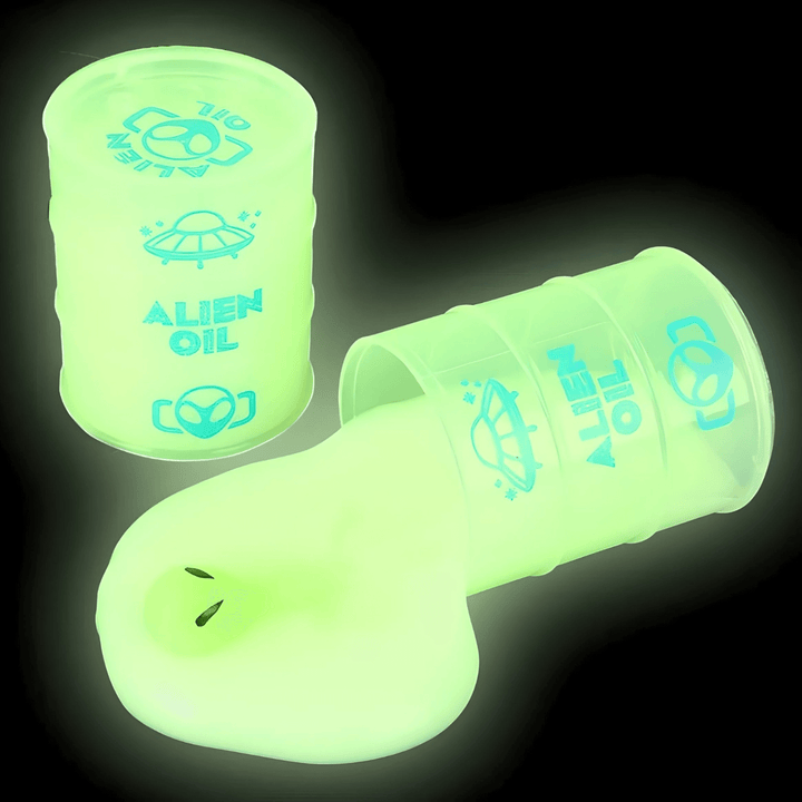 2.25" Alien Glow in the Dark Slime in an oil barrel, glowing bright green, perfect for kids' fun and play.