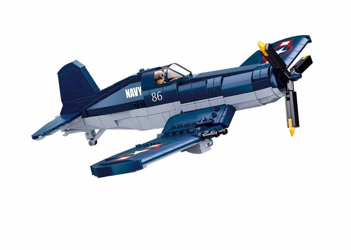 Sluban WWII F-4U Fighter Plane Building Set modeled in flight, showcasing its iconic gull-wing design and details.