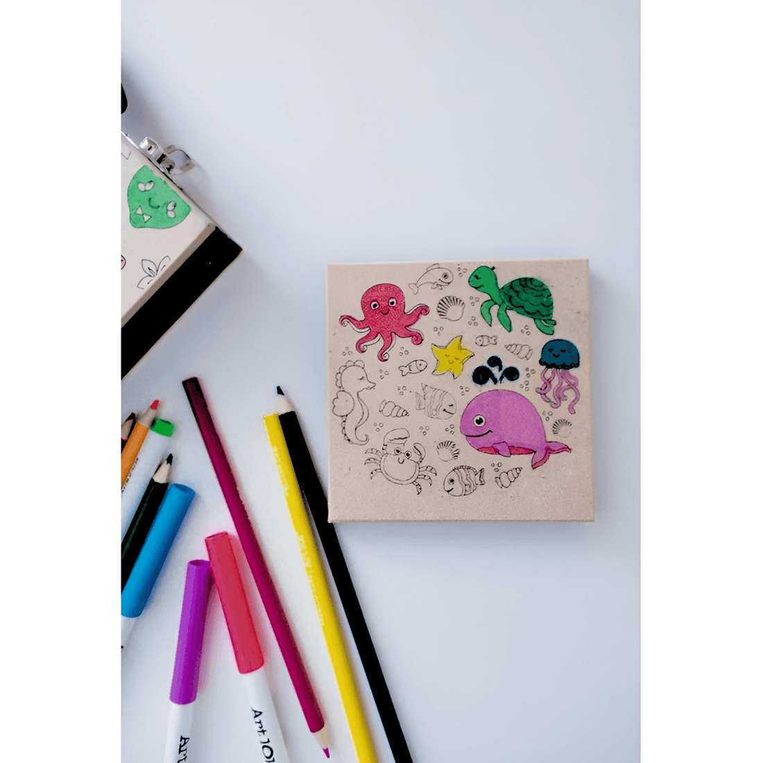 Art 101 Budding Artist 33 Piece Doodle & Create Colorable Art Set with colorful drawings and art supplies.