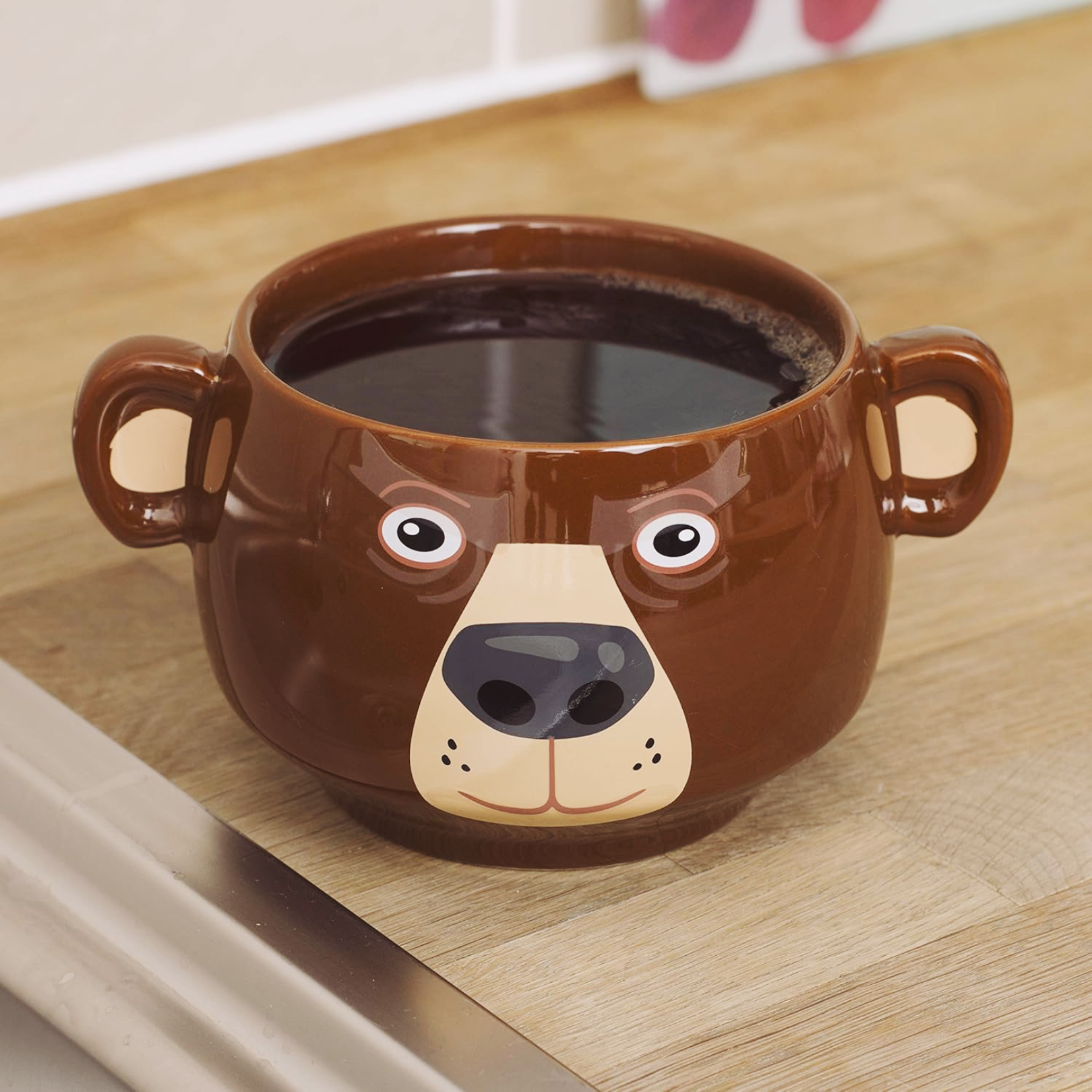 Bear Heat Change Mug styled as a cheerful bear face, holding warm coffee, ideal for cozy mornings.