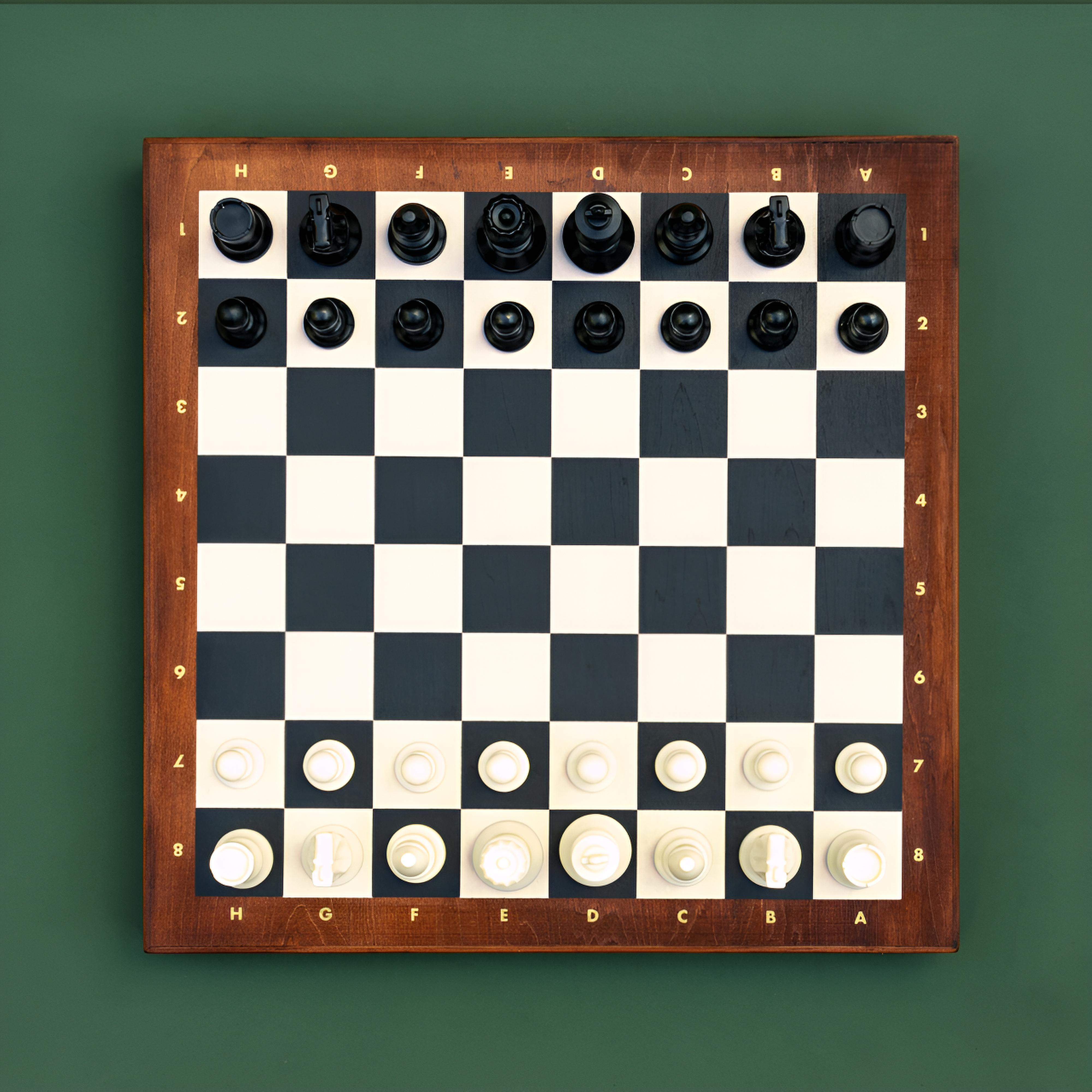 Chess Deluxe - Premium wooden chess set with full size resin pieces on a board.