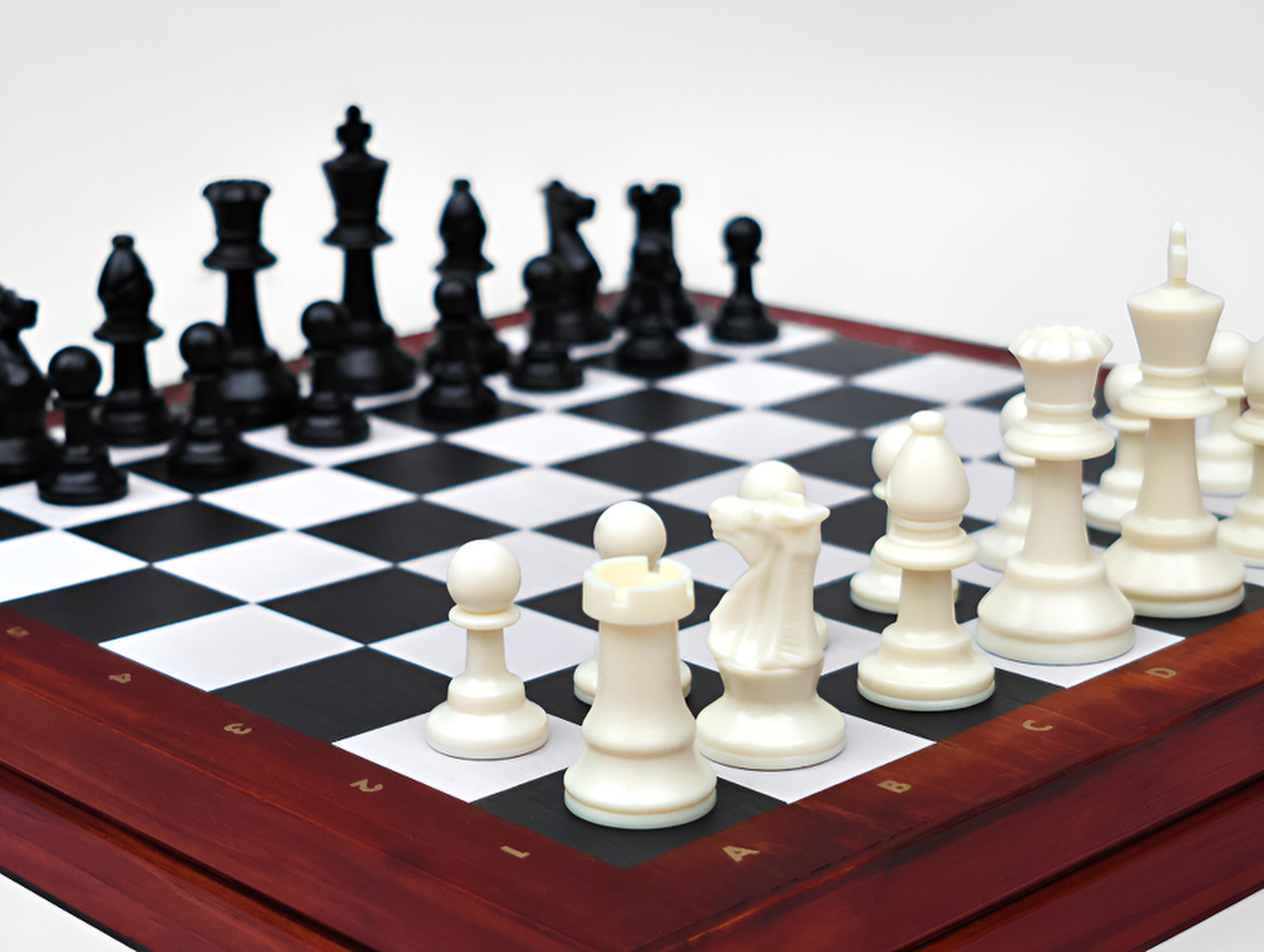 Chess Deluxe wooden chess set featuring full-size resin pieces on a classic chess board.