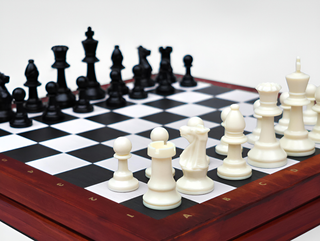 Chess Deluxe wooden chess set featuring full-size resin pieces on a classic chess board.