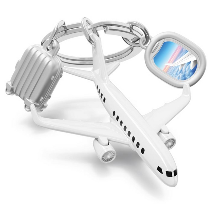 Keychain shaped like an airplane with a heart-shaped window displaying a colorful sky.