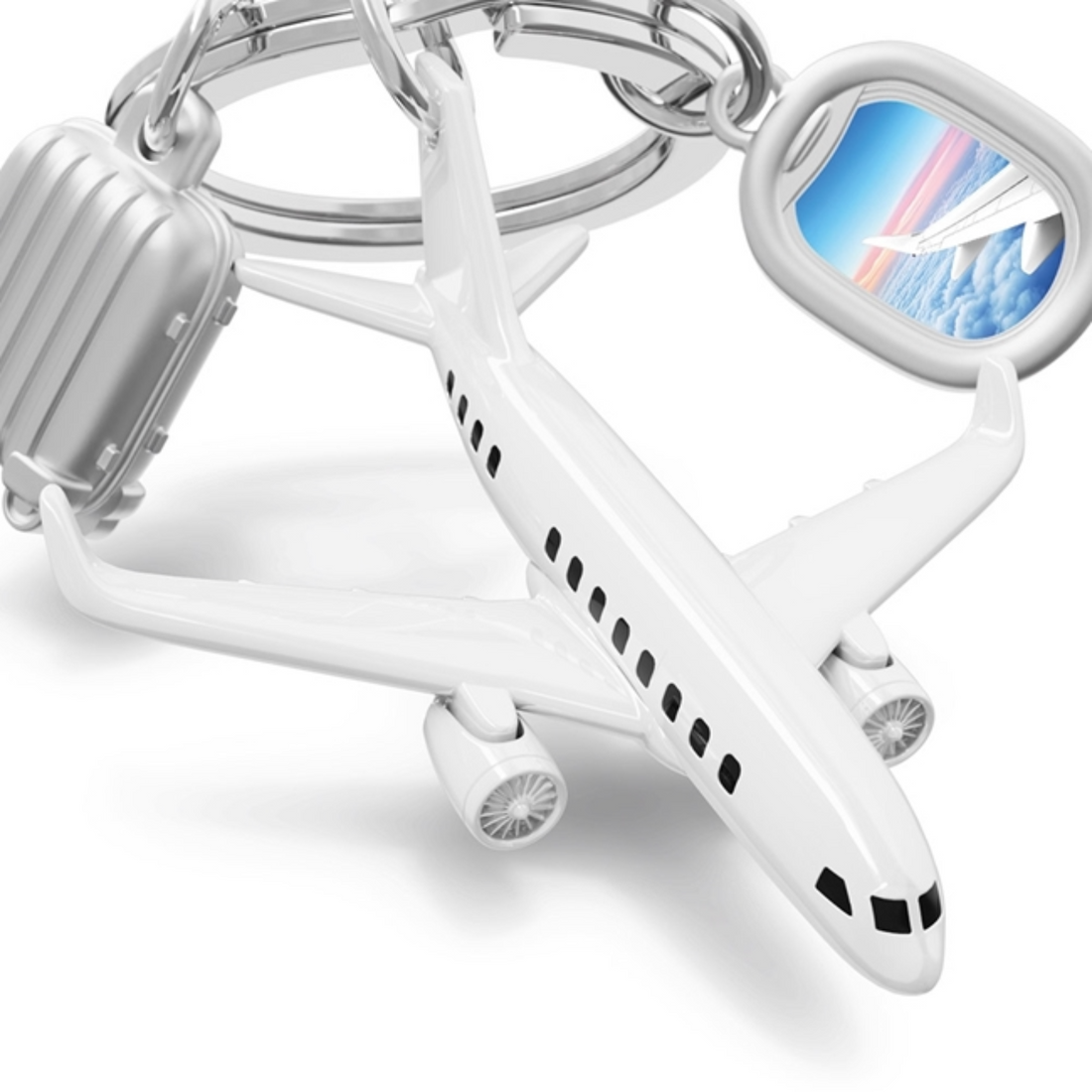 Keychain shaped like an airplane with a small window display on a white background
