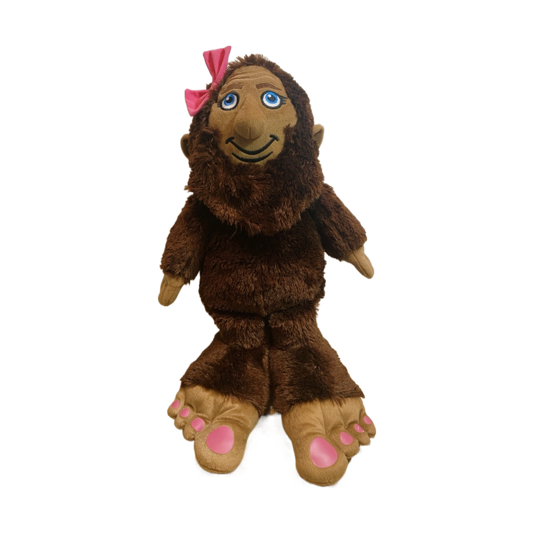 Miss BigFoot SheSquatch plush toy with brown fur, pink toenails, and a decorative hair bow, perfect for gifting.
