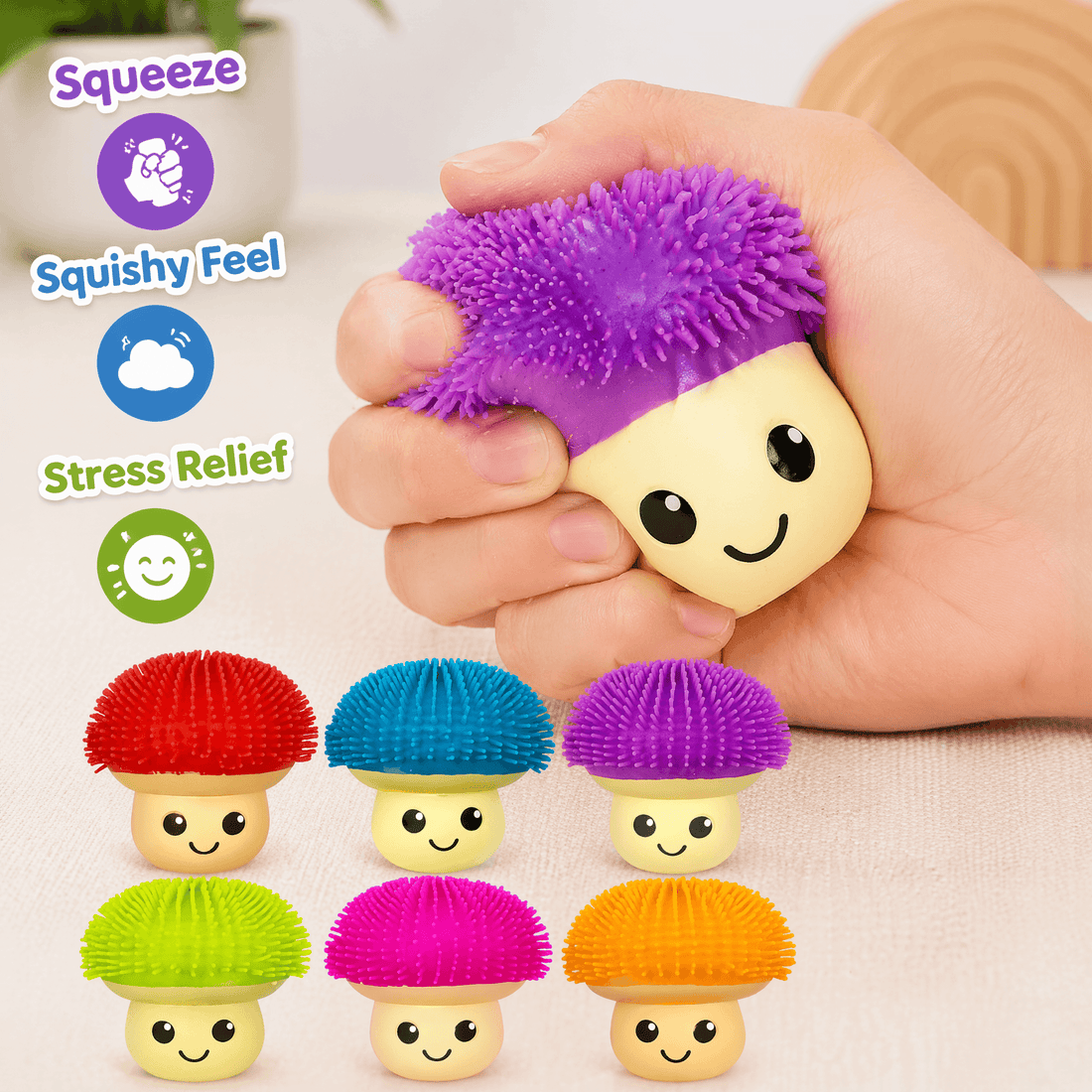 Colorful mushroom-shaped stress relievers with a hand squeezing one, on a light background.
