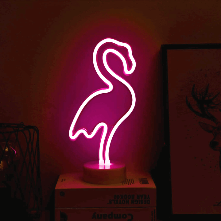 Pink Flamingo LED Night Light in neon silhouette, providing warm ambient glow for various spaces.