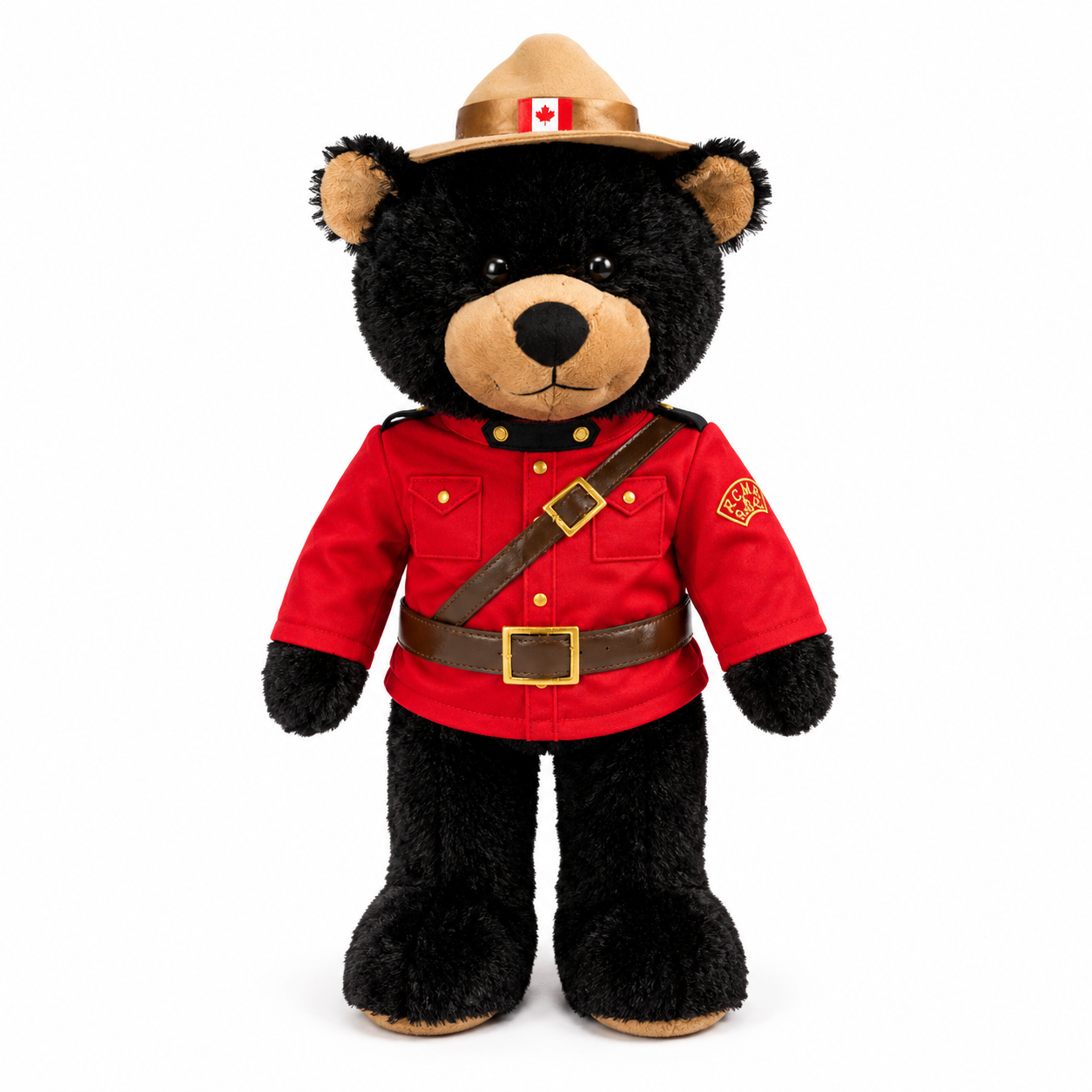 Plush bear toy in RCMP uniform with red jacket and tan hat on a white background