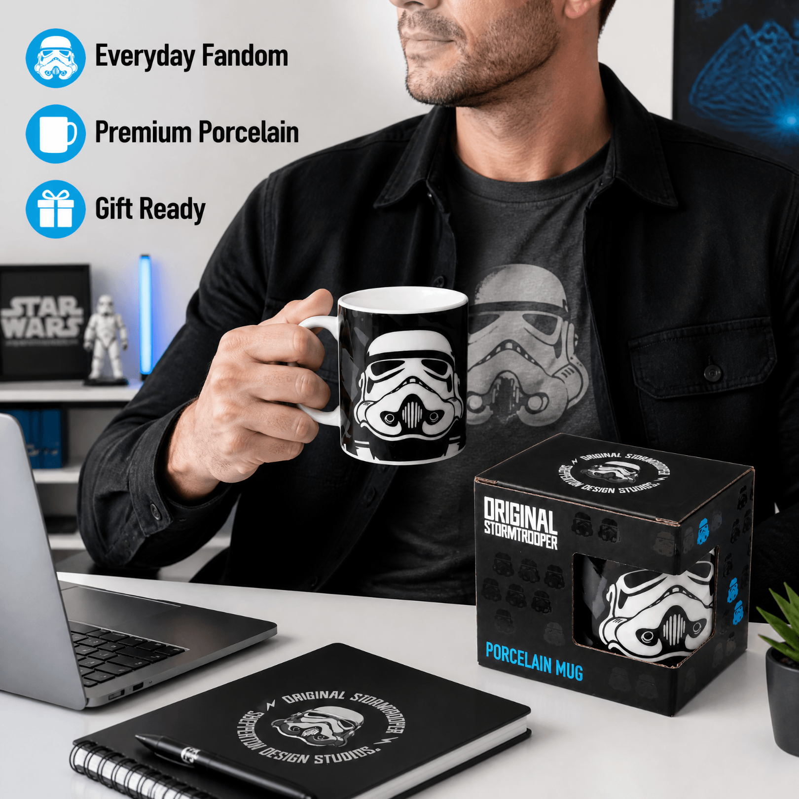 Stormtrooper Black Porcelain Mug held by a man, showcasing its design and packaging on a desk with office supplies.