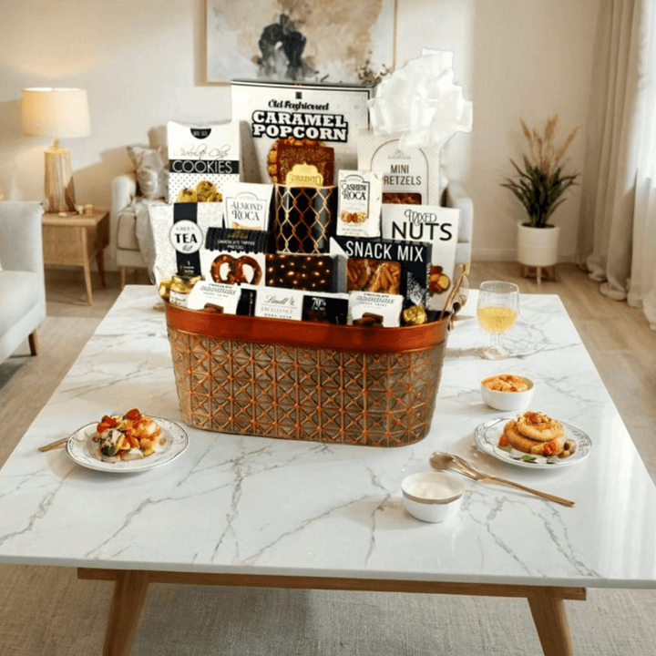 The Luxe Crunch Gift Basket – Truffles, Coffee & Snacks showcased on a marble table with snacks and treats.
