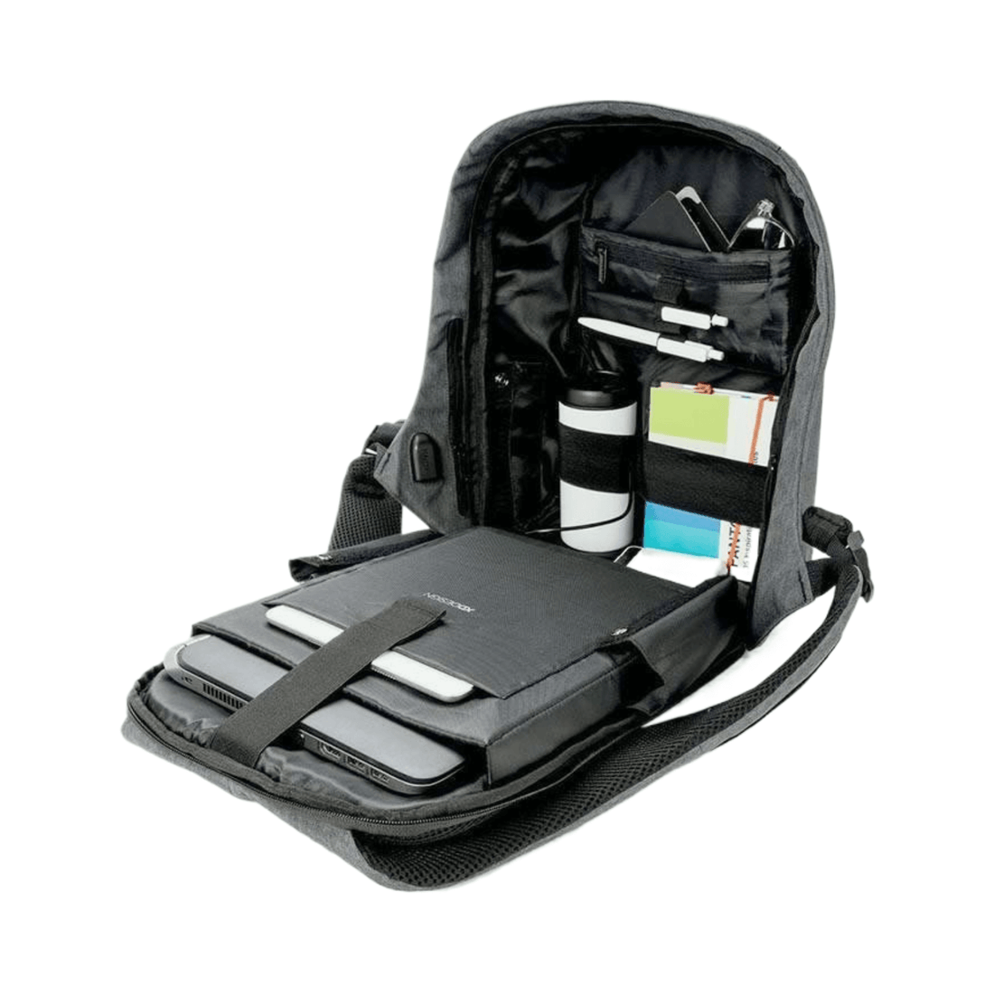 XD Design Bobby Compact Anti-Theft Backpack interior showing organized compartments and various accessories.