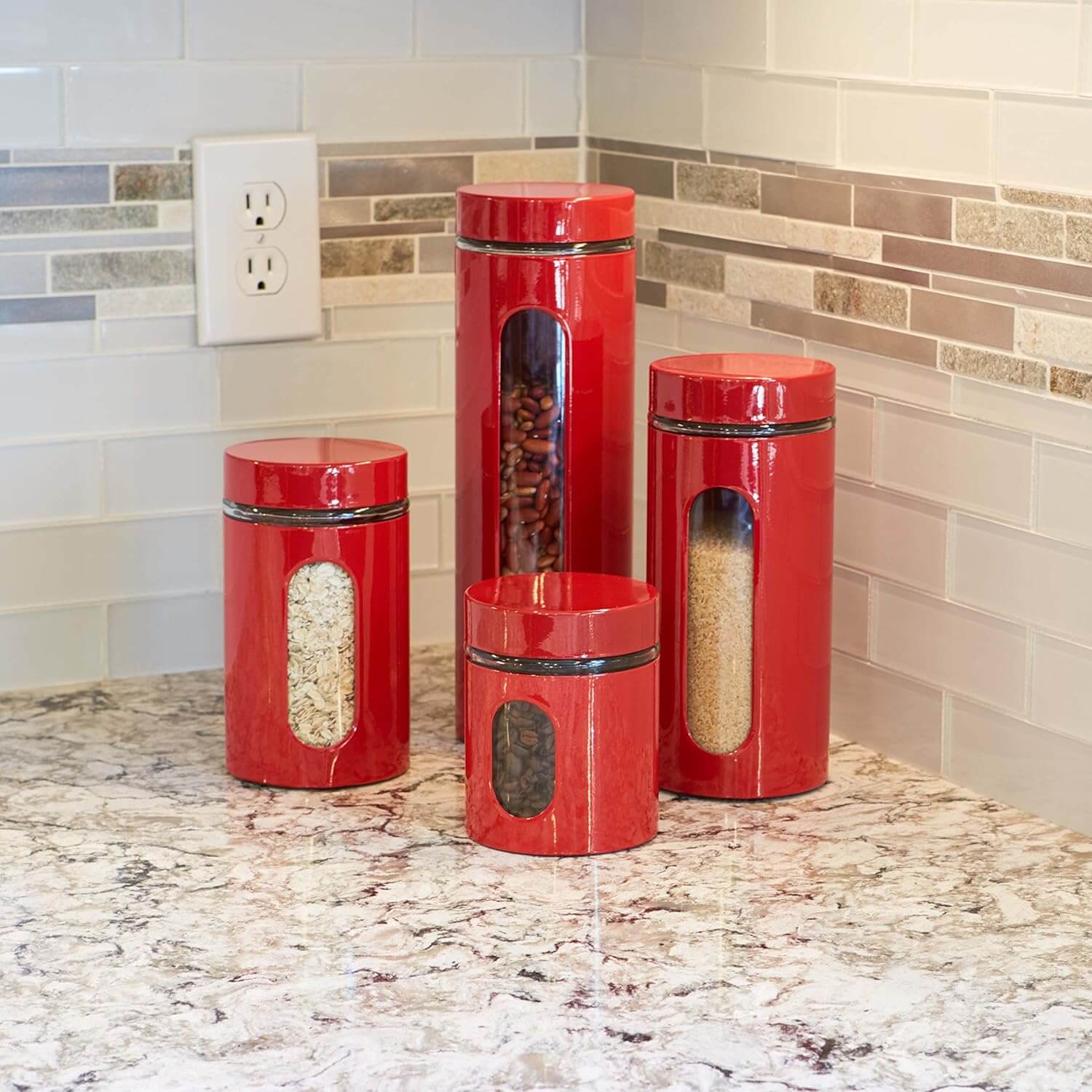 Red Anchor Hocking 4-piece canister set with airtight lids on a kitchen countertop for stylish organization.