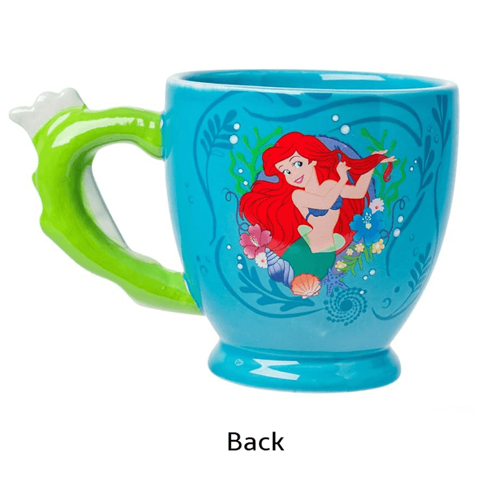 Back view of Ariel 3D shaped mug with a colorful design and green hairbrush handle.