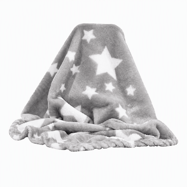 A plush gray blanket draped to show its texture, featuring a pattern of white stars of various sizes and a fringed edge, set against a plain white background.