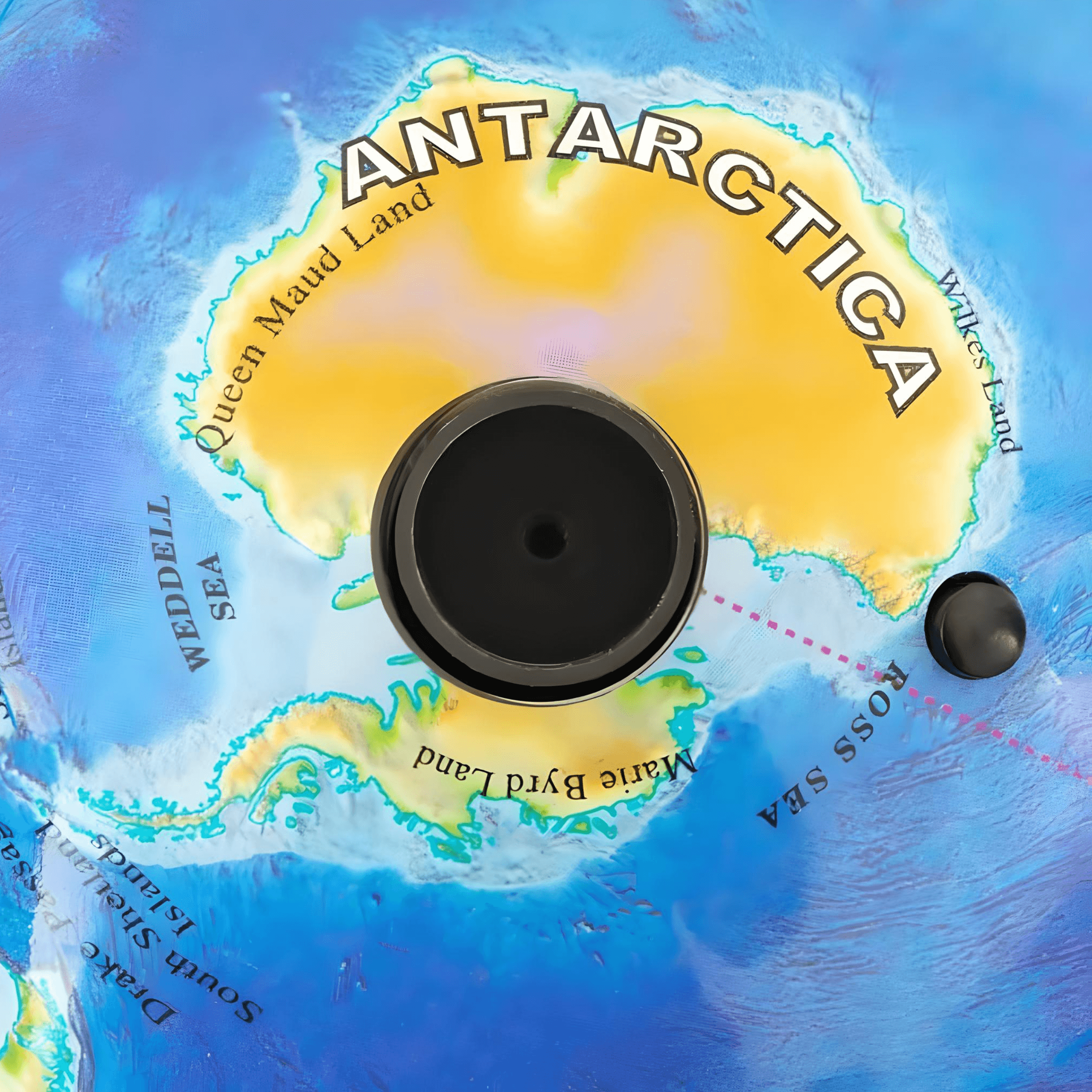 Close-up of Antarctica on a rotating globe, highlighting Queen Maud Land and surrounding seas.