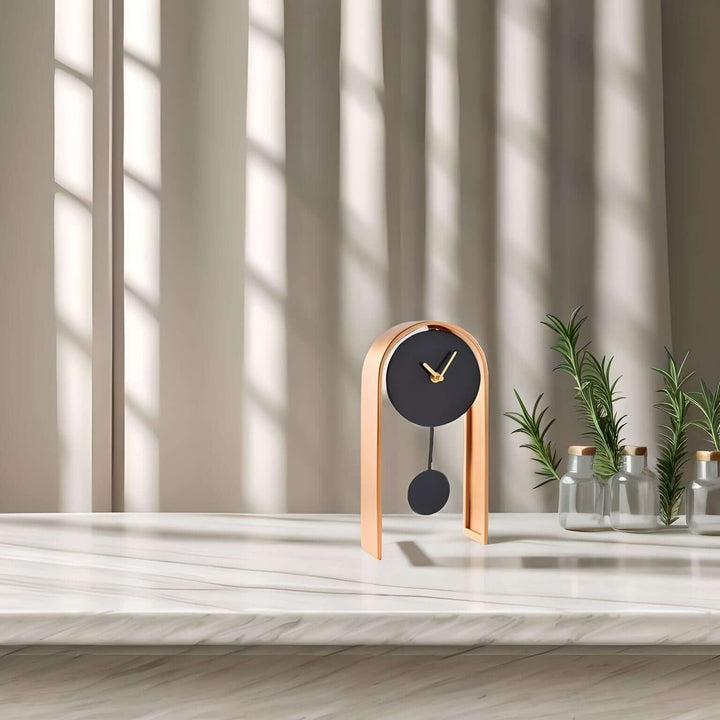 Black & Gold Table Clock showcasing modern design with a black face and gold frame, perfect for stylish decor.