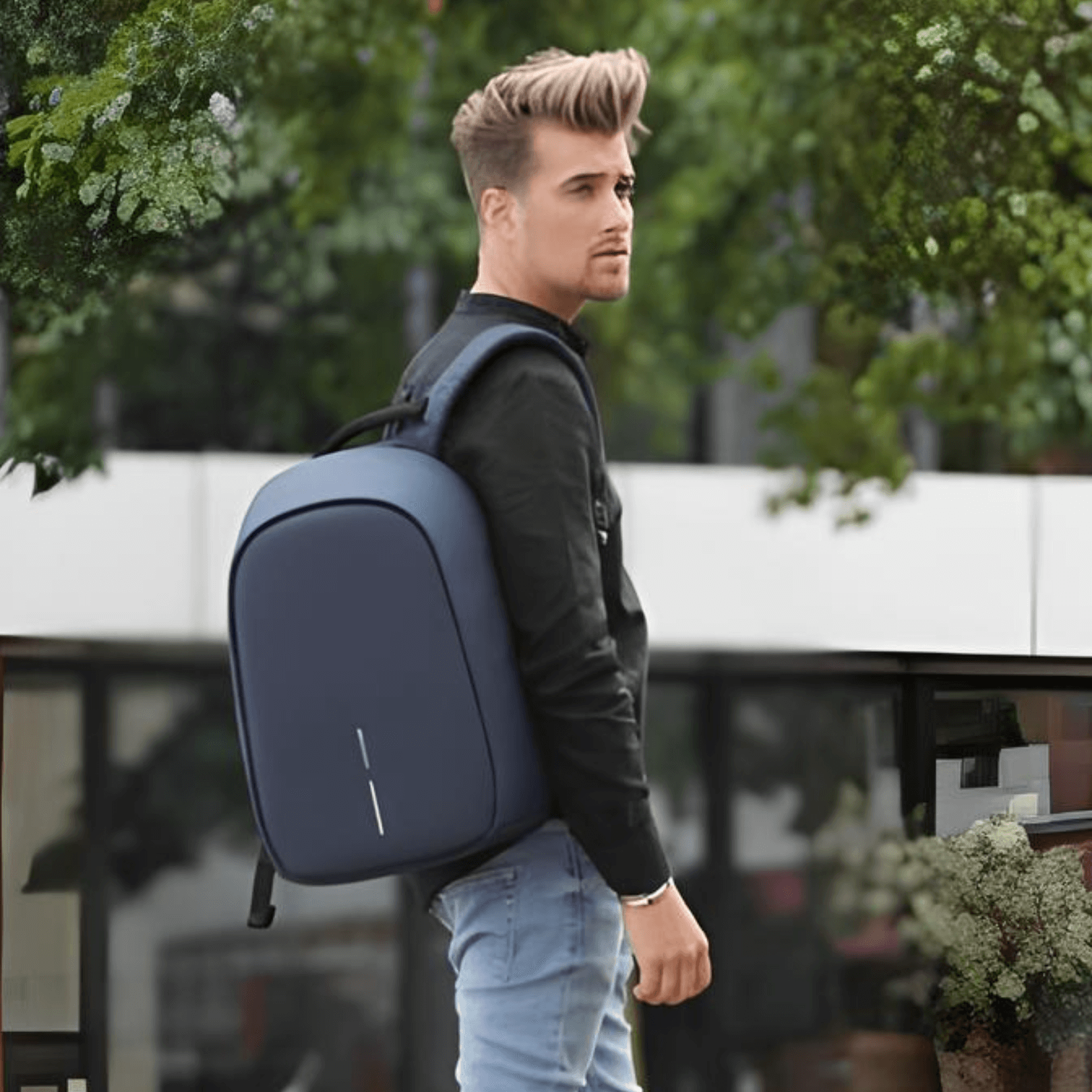Model wearing the Bobby Hero Regular Anti-Theft Backpack in Navy, showcasing its stylish design and practicality.