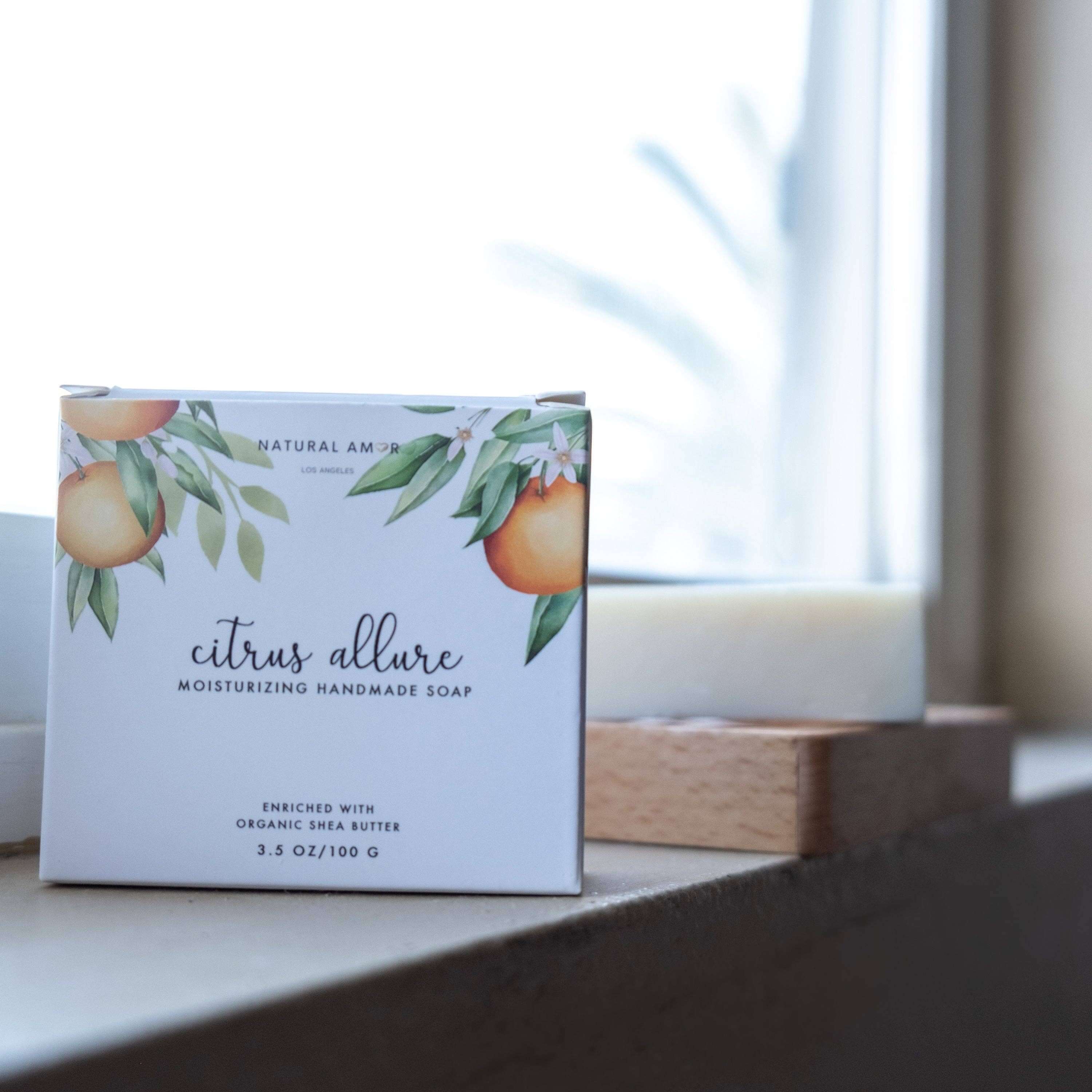 Citrus Allure moisturizing handmade soap by Natural Amor, enriched with organic shea butter, displayed on a wooden surface.