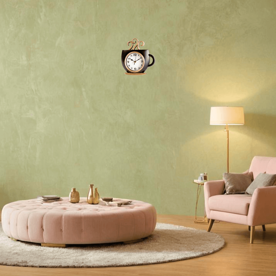 Coffee mug wall clock in black and gold hanging on a green wall above a pink ottoman and cozy seating.