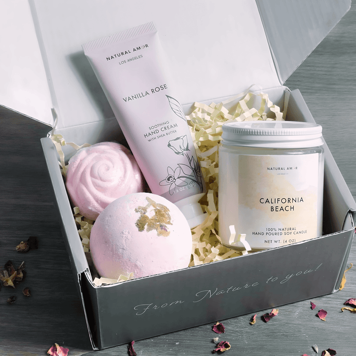 Cozy Spa Gift Set by Natural Amor featuring hand cream, bath bombs, and candle for ultimate relaxation.