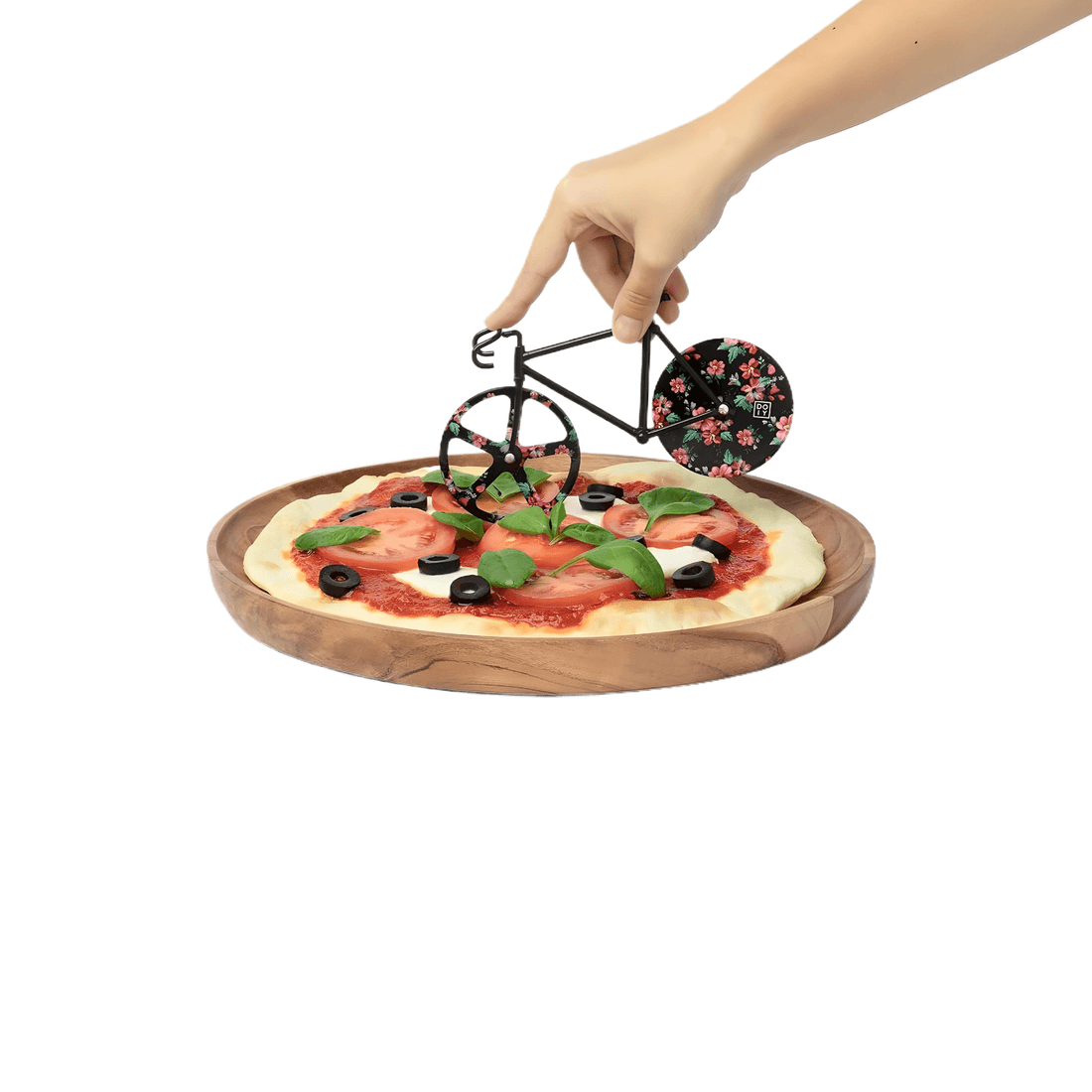 Fixie Pizza Cutter with Wild Rose design being used on a fresh pizza, showcasing its unique bicycle shape and artistic flair.