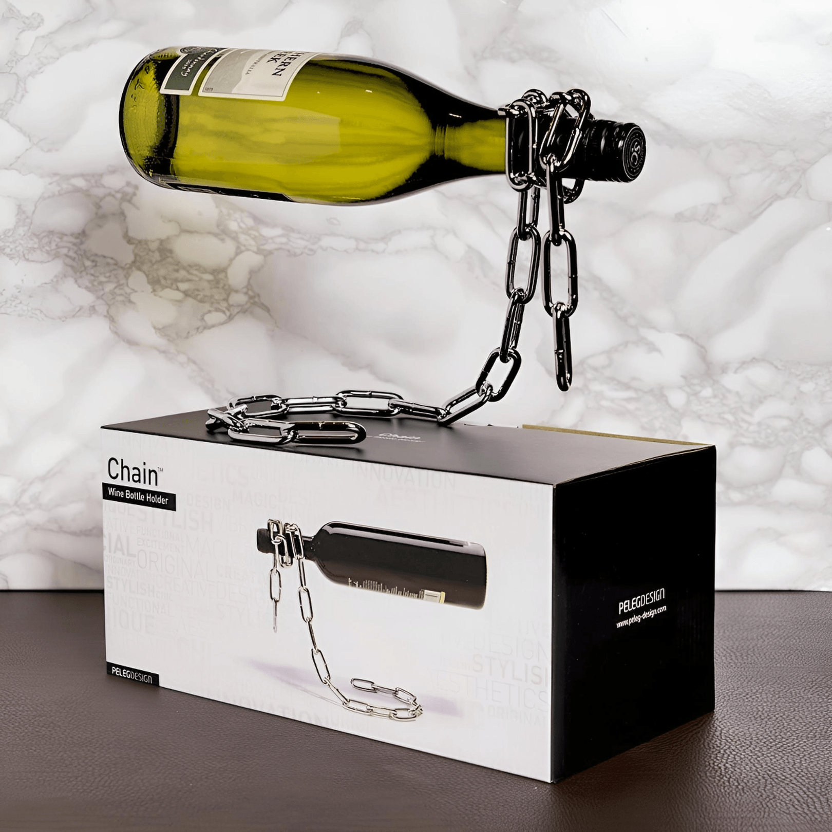Floating Chain Wine Bottle Holder displaying a wine bottle above its retail gift box, showing the suspended metal chain illusion design