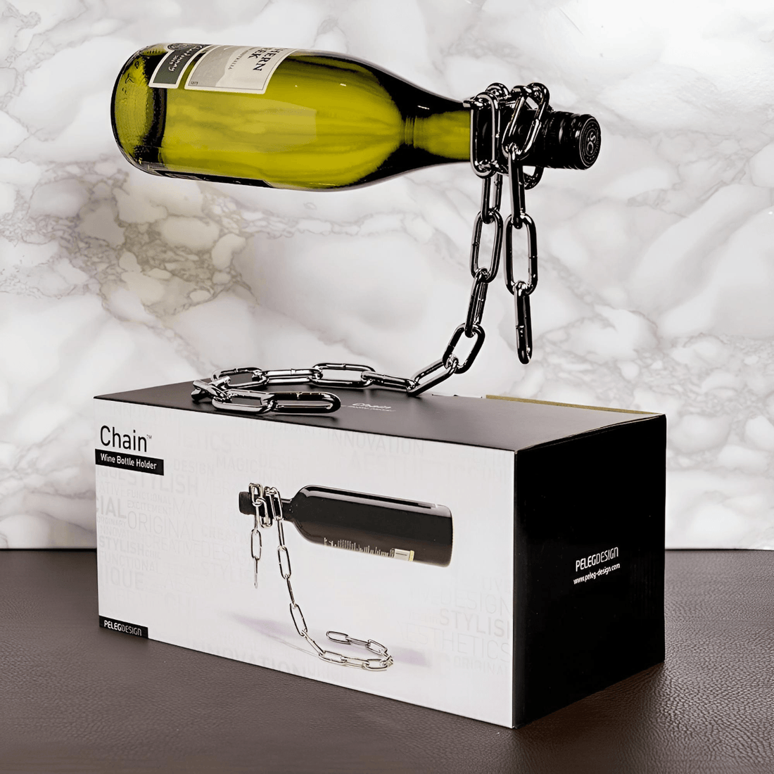 Floating Chain Wine Bottle Holder displaying a wine bottle above its retail gift box, showing the suspended metal chain illusion design