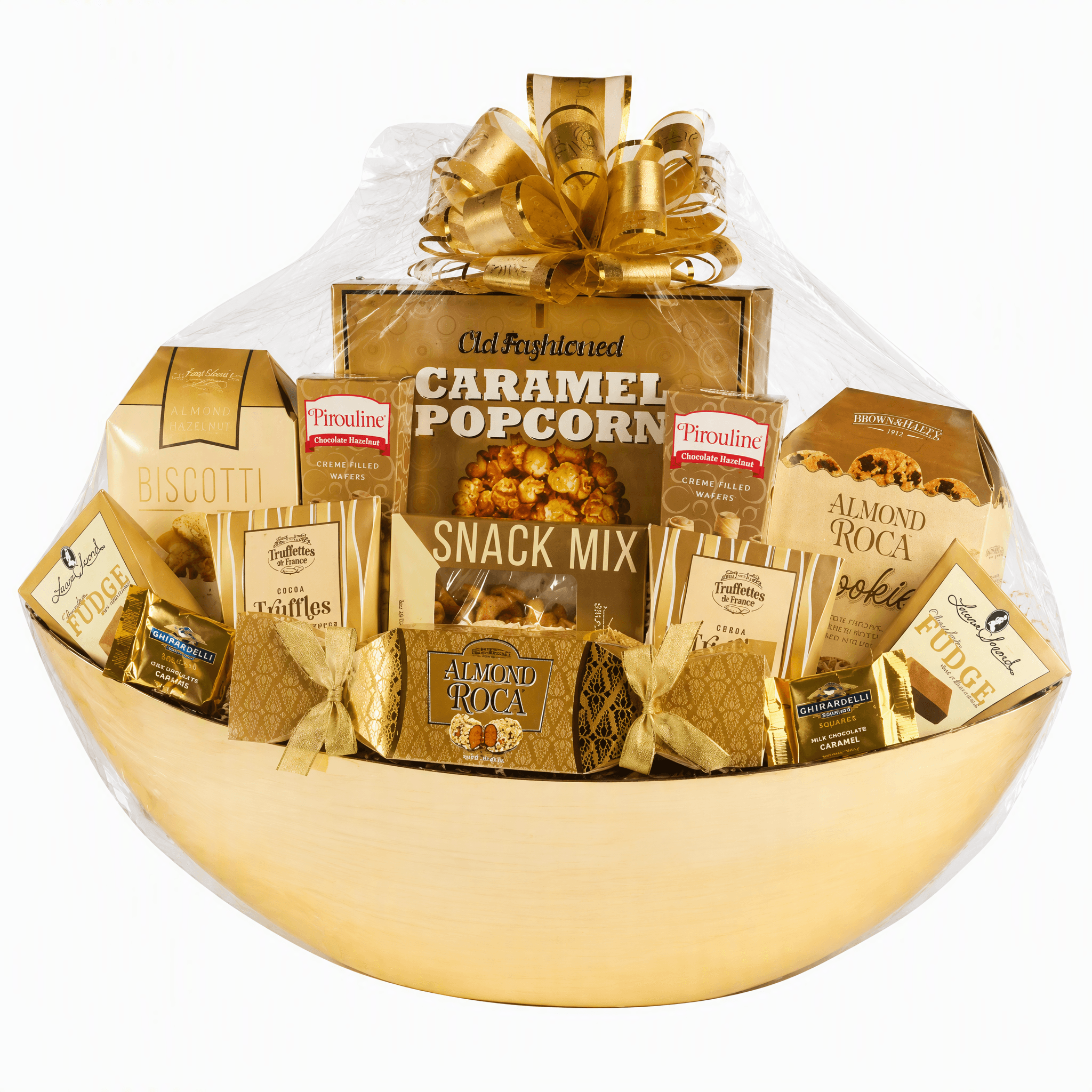 A gold gift basket filled with assorted gourmet snacks and treats, including Old Fayette Caramel Popcorn, Pinelli Taffies, and Almond Roa chocolate, wrapped in clear cellophane with a large gold bow on a white background.