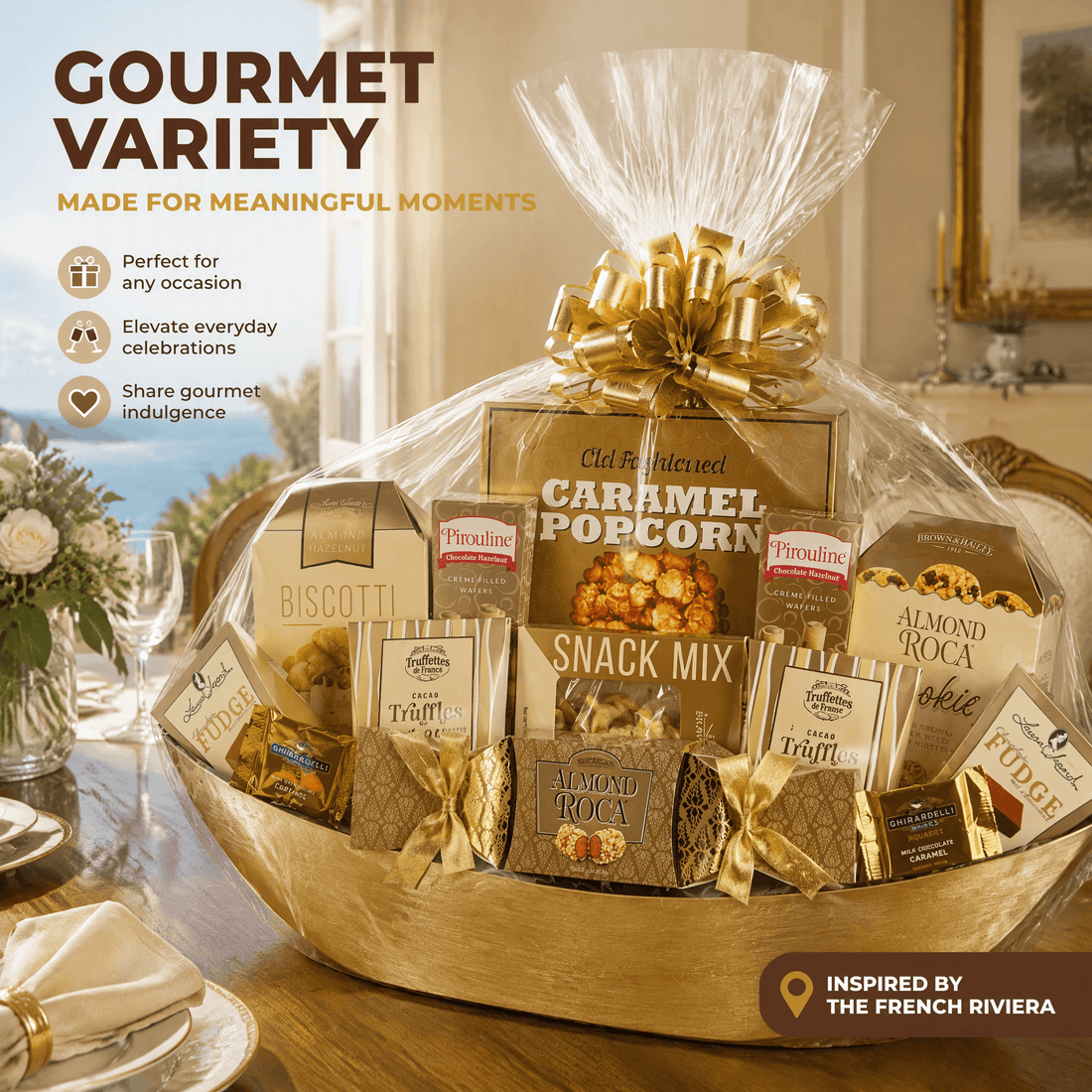 A gourmet gift basket filled with assorted packaged snacks and treats, wrapped in clear cellophane and tied with a large gold bow, set on a dining table. The basket includes items such as caramel popcorn, biscotti, almond roca, and truffle packs.
