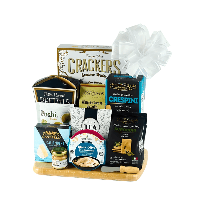 Gourmet Graze Board gift basket featuring cheese, crackers, hummus, olives, and a bamboo cutting board.