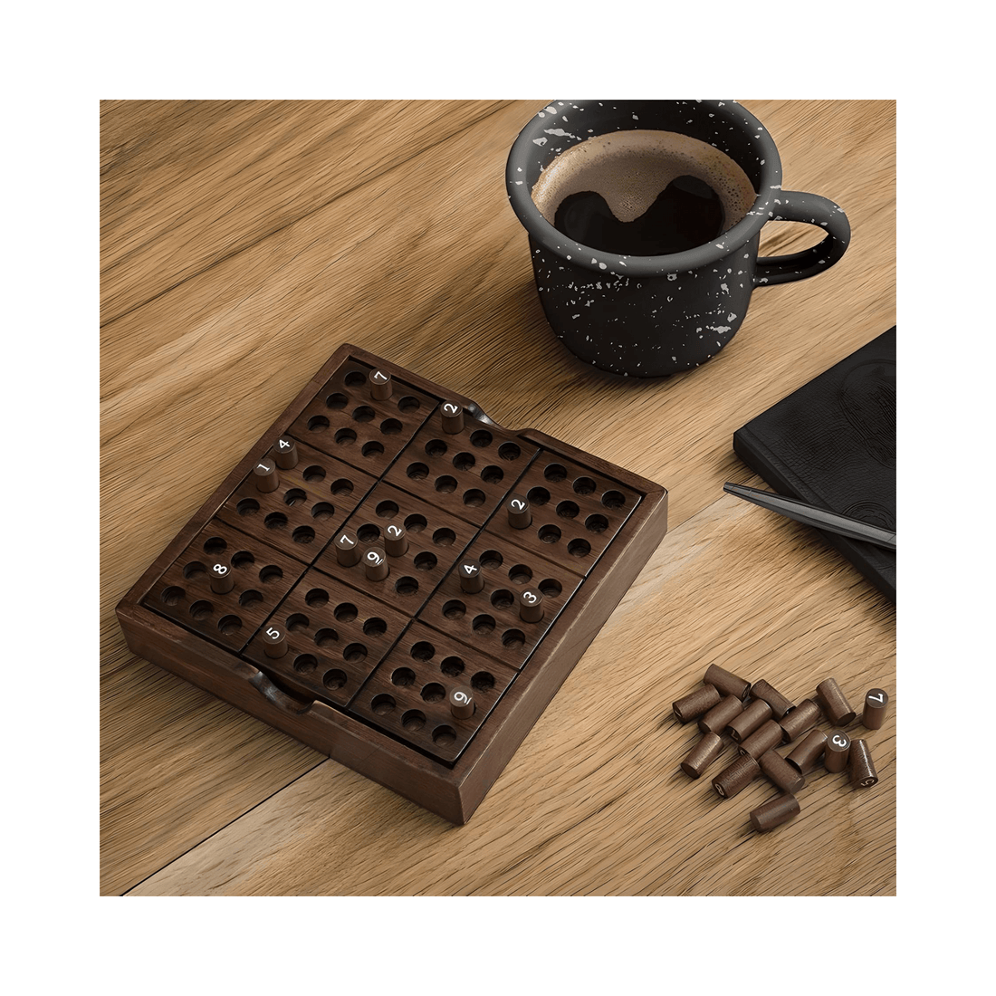 Iron And Glory Wooden Sudoku Puzzle Board in use on a table with numbered wooden pieces and coffee mug