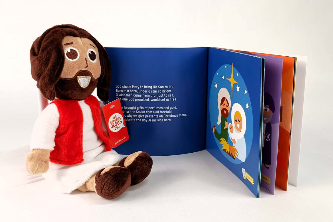 Plush Jesus doll beside an open Bible storybook, perfect for kids, combining faith and fun in one bundle.