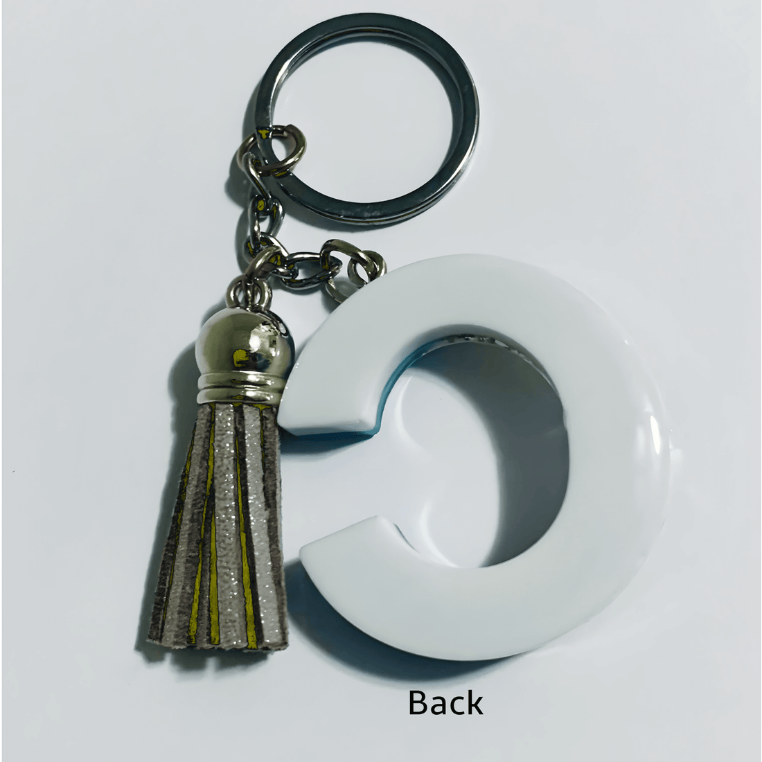 Letter C Resin Keychain – Blue & White Marbled Charm featuring a white letter C and a tassel detail.