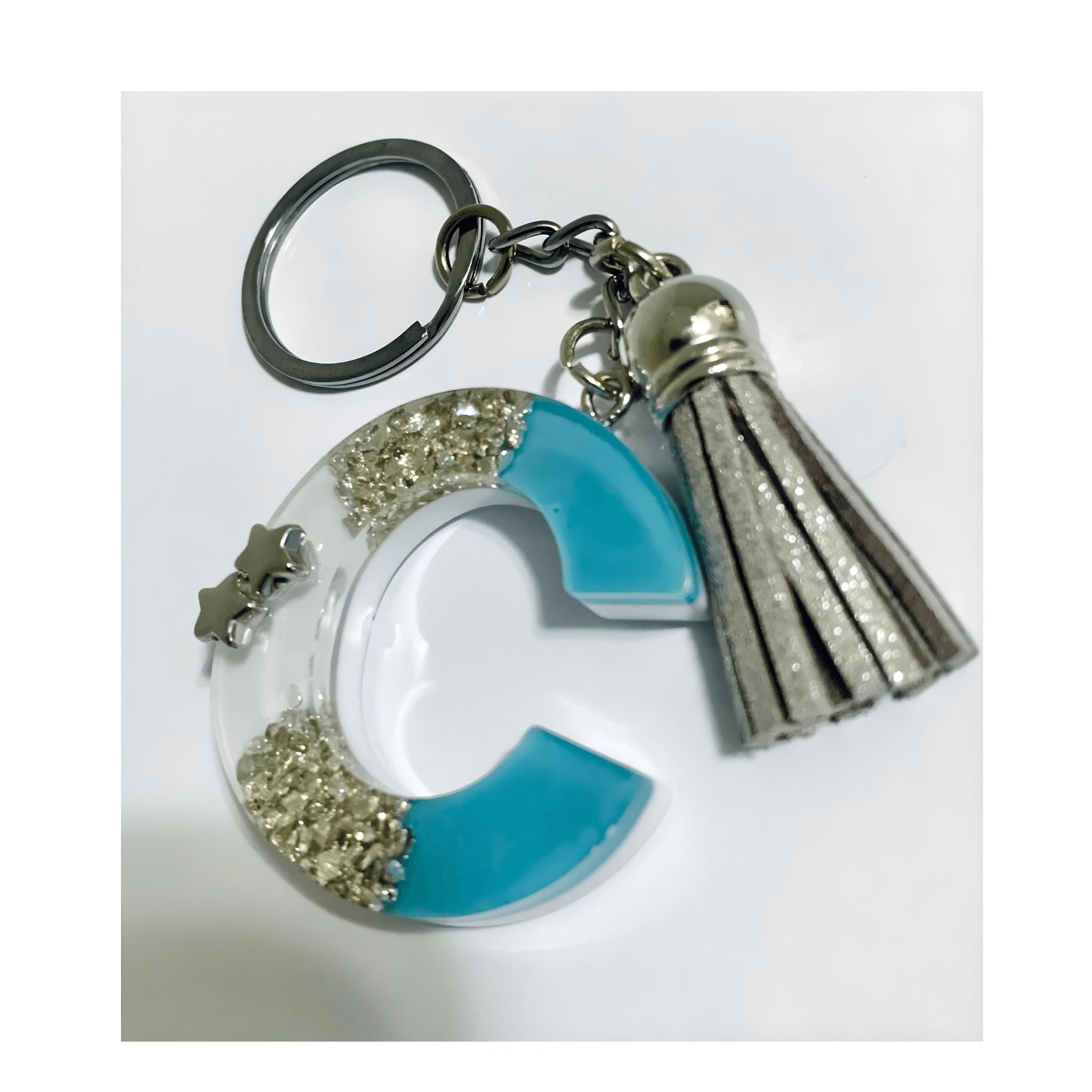 Letter C Resin Keychain – Blue & White Marbled Charm with silver tassel and star embellishments.
