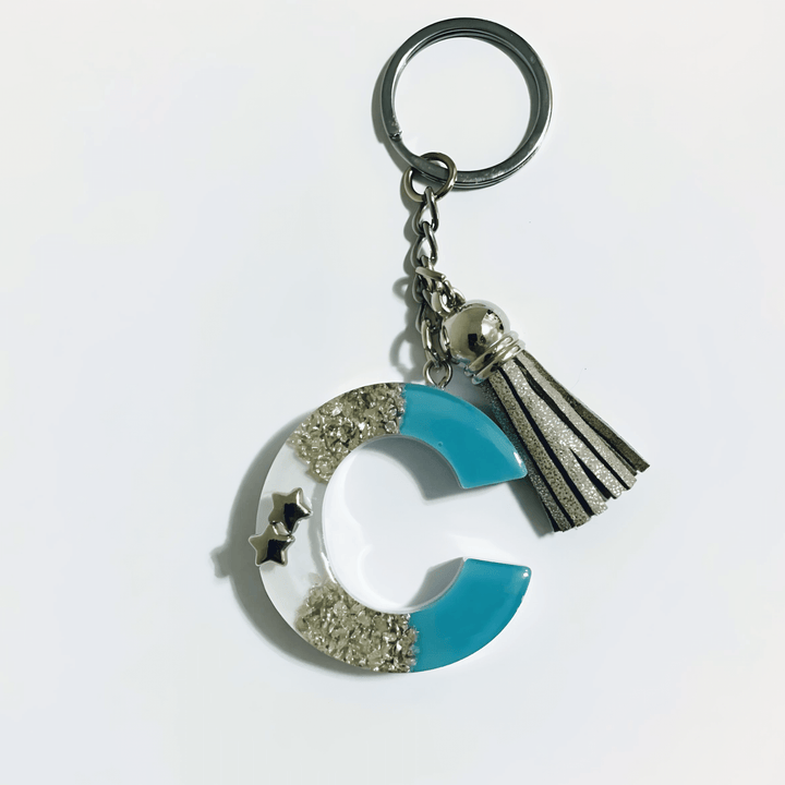Letter C Resin Keychain – Blue & White Marbled Charm with silver and blue accents.