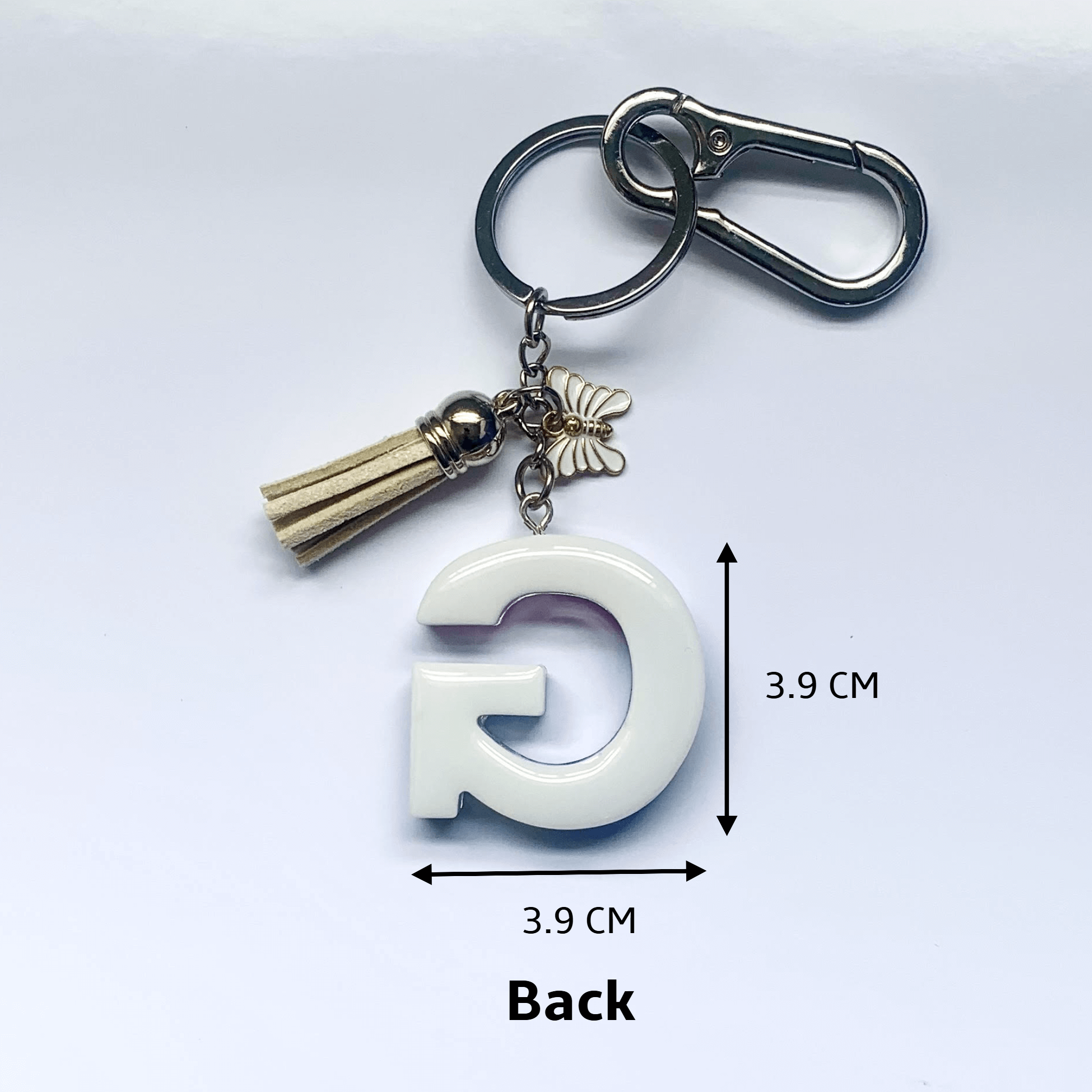 Letter G Keychain with Carabiner – Glitter & Tassel Charm featuring a tassel and butterfly embellishment.