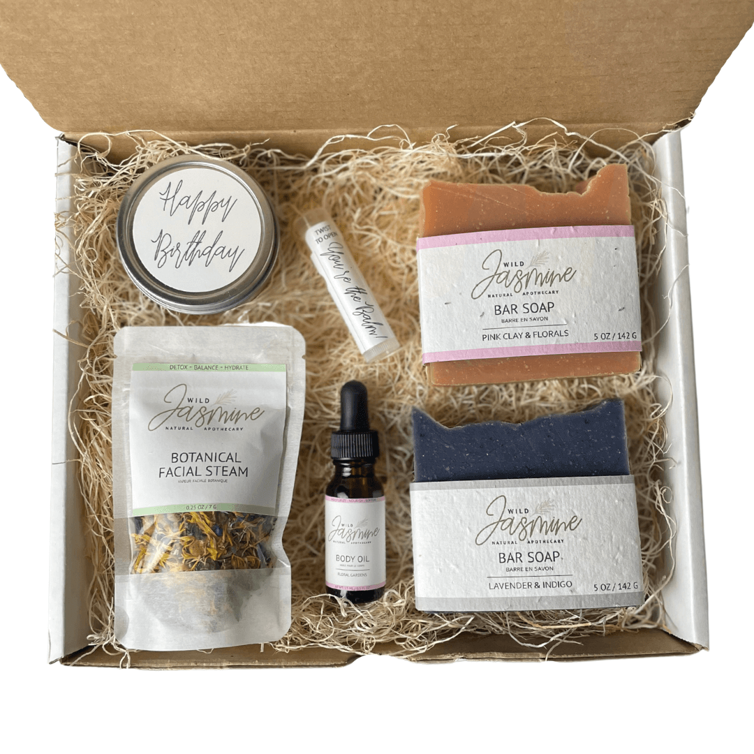 Gift set with bar soaps, facial steam, and other products in a box