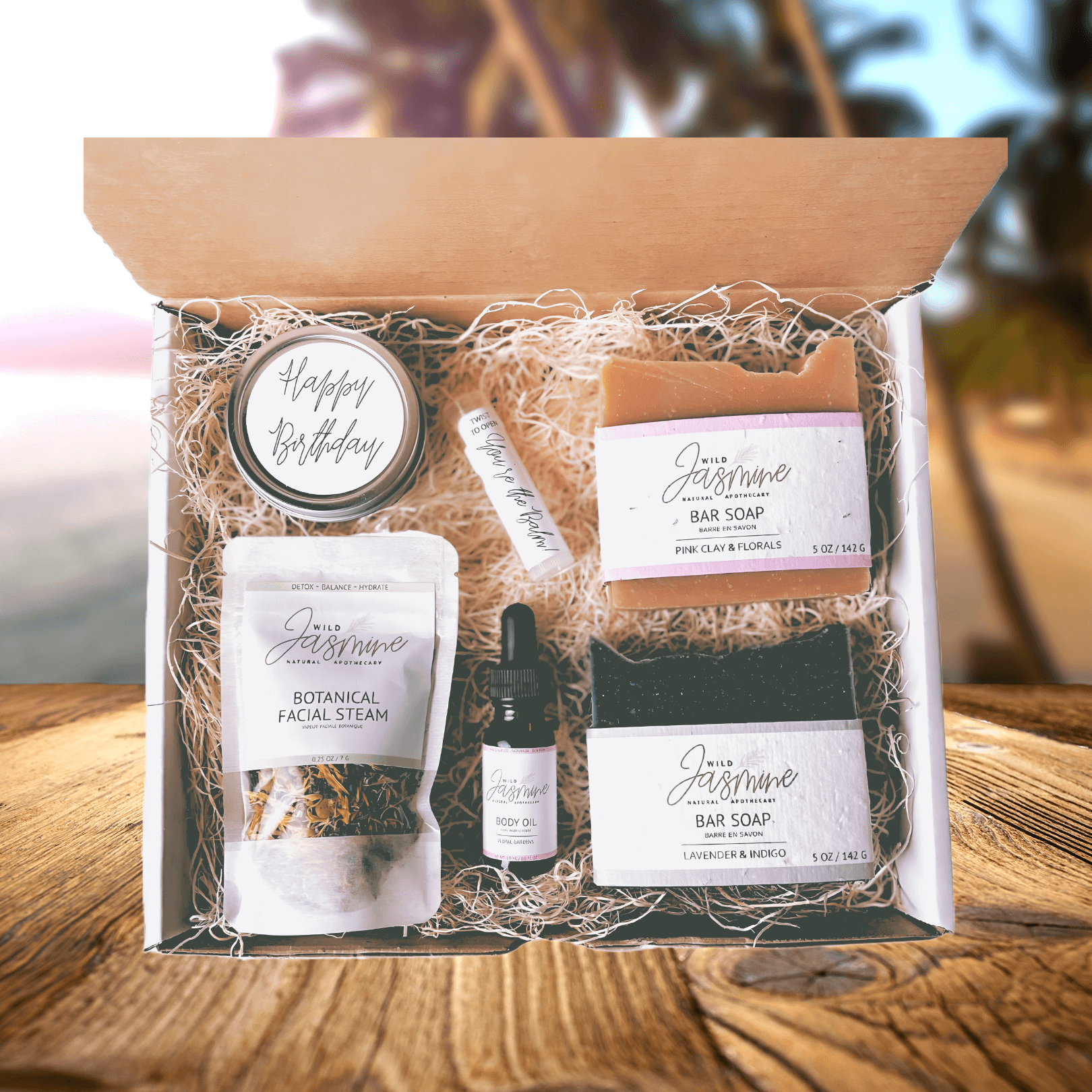 Gift set with bar soaps, facial steam, and other products in a box