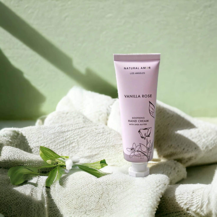 Natural Amor Vanilla Rose hand cream on a cozy blanket for ultimate relaxation.
