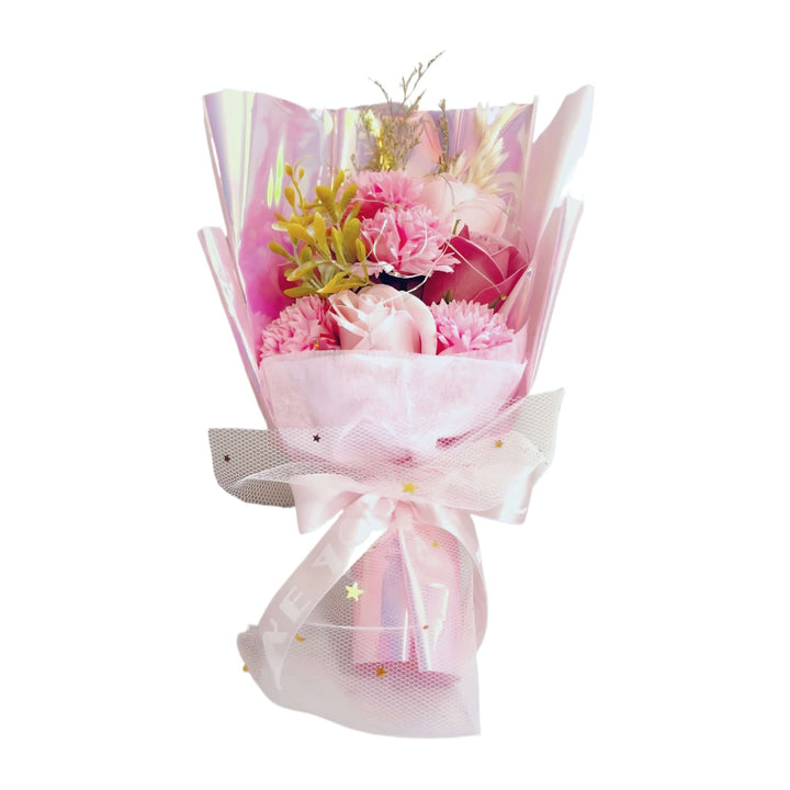 Pink flower bouquet wrapped elegantly, featuring soft hues and accents, perfect for adding charm to any occasion.
