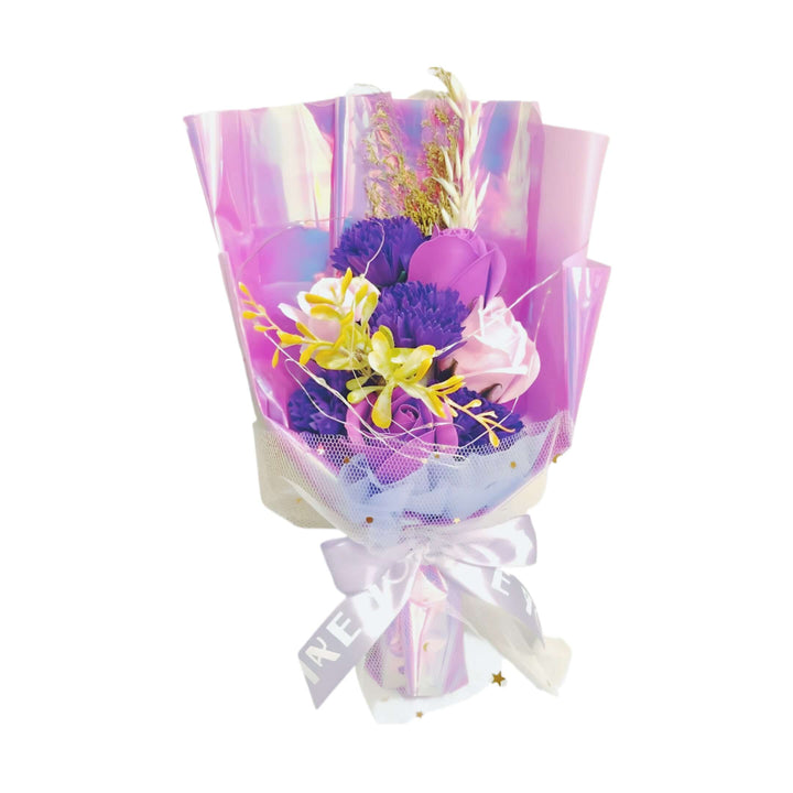 Purple flower bouquet with LED lights in elegant packaging for stunning decor.
