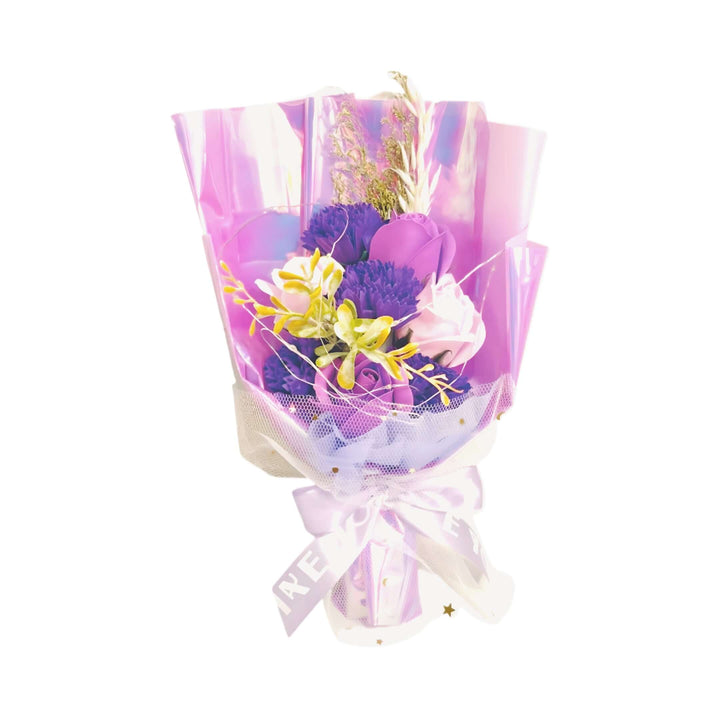Stunning purple flower bouquet wrapped in shimmering paper, perfect for gifting and special occasions.