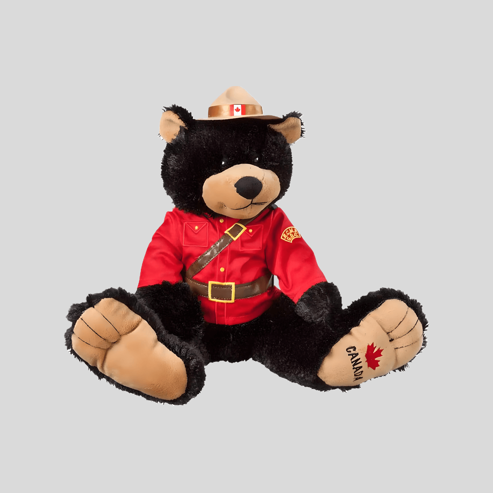 RCMP Bigfoot Bear Plush Toy dressed in red serge uniform, soft black bear with oversized feet, 14 inches of cuddly comfort.