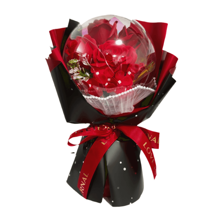 Red rose bouquet in acrylic dome with lights, beautifully wrapped in black and red with decorative ribbons.