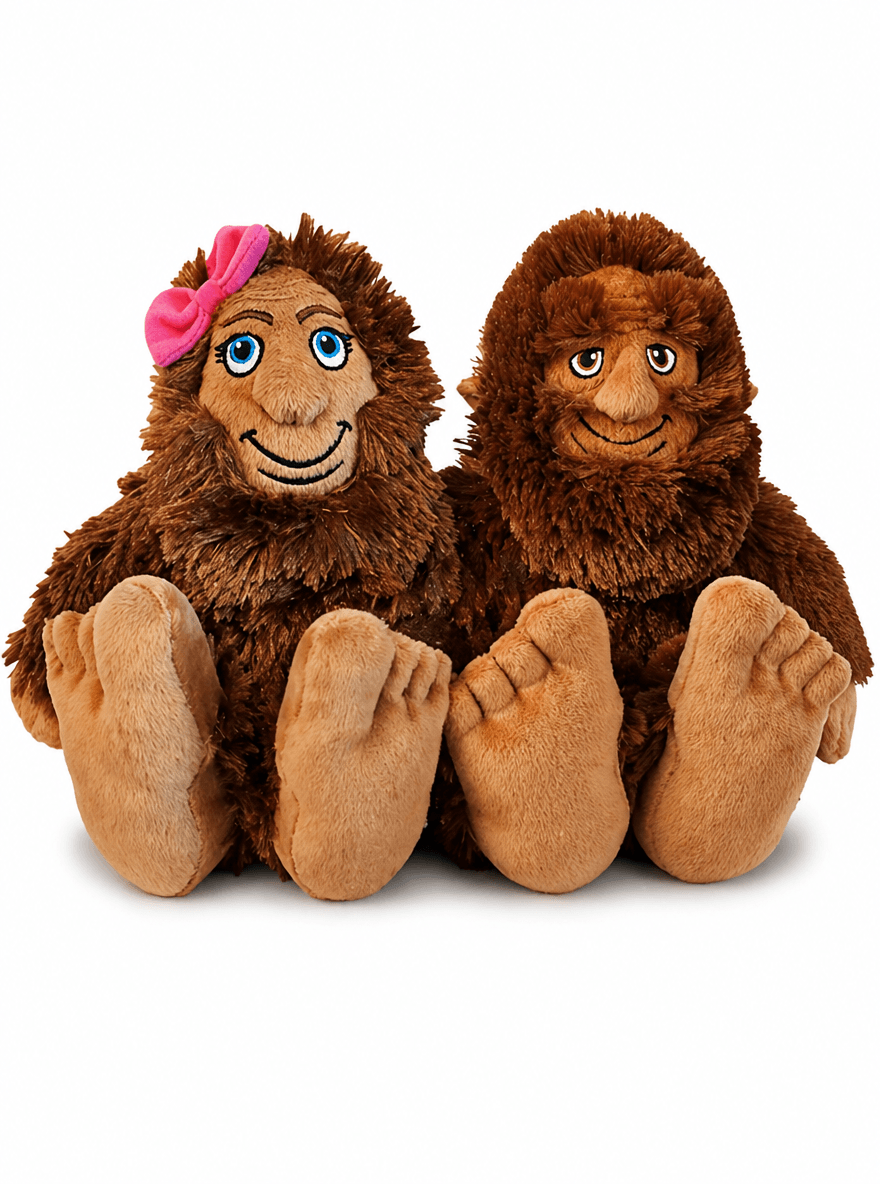 Sasquatch Sweethearts Plush Gift Set featuring two cute Bigfoot plush toys, one wearing a pink bow, perfect for quirky gifts.