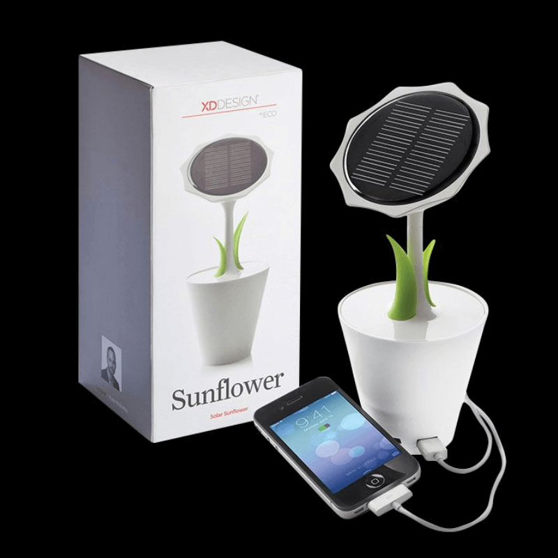 Sunflower Solar Charger in a flower pot with solar panel, charging a phone via USB, featuring green leaves.