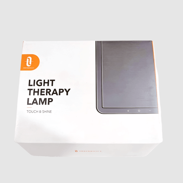 TaoTronics Light Therapy Lamp packaging showing touch and shine features for bright, natural light.