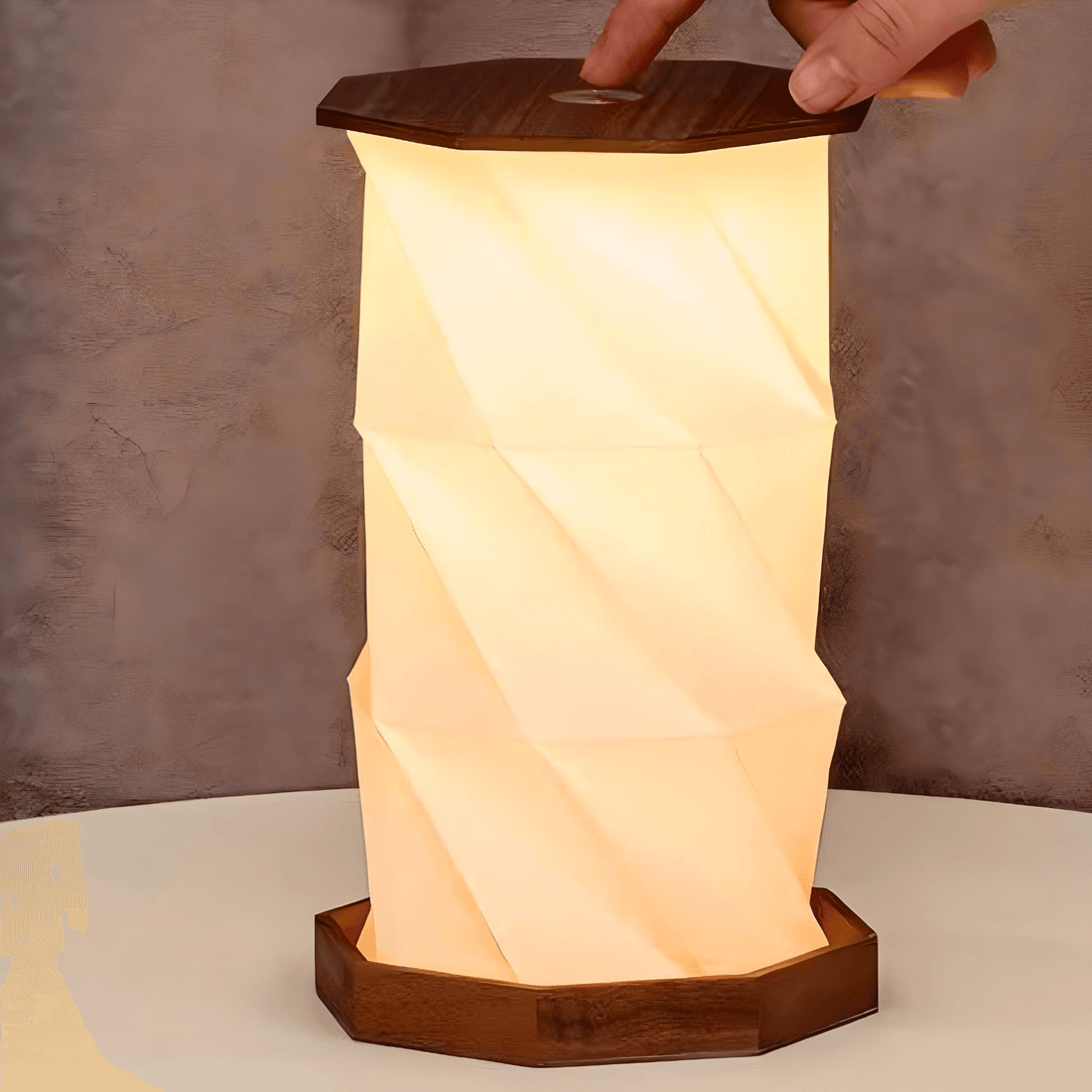 Twist Hexagon Lamp in Walnut, featuring a modern design with elegant folds and warm light for stylish decor.